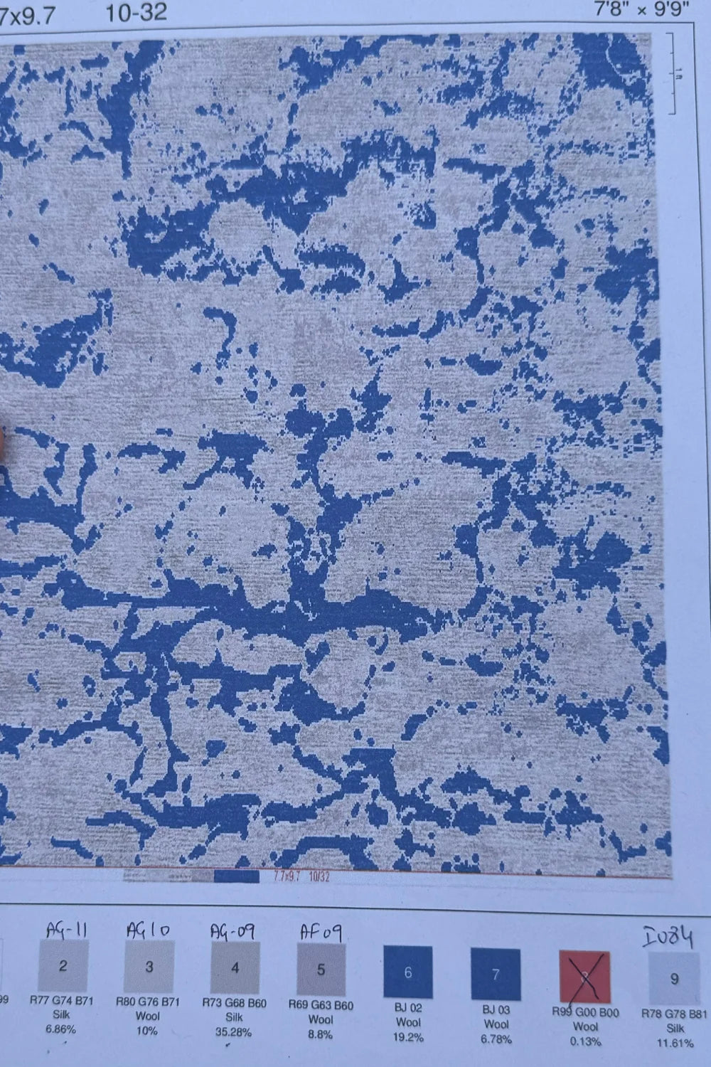 Modern living room rug with blue and beige abstract hand-knotted design.