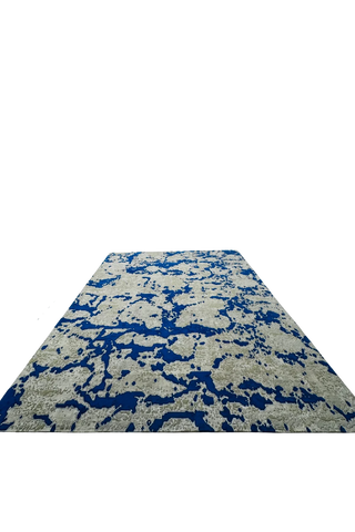 Handwoven modern wool rug with blue and beige digital pixel style.