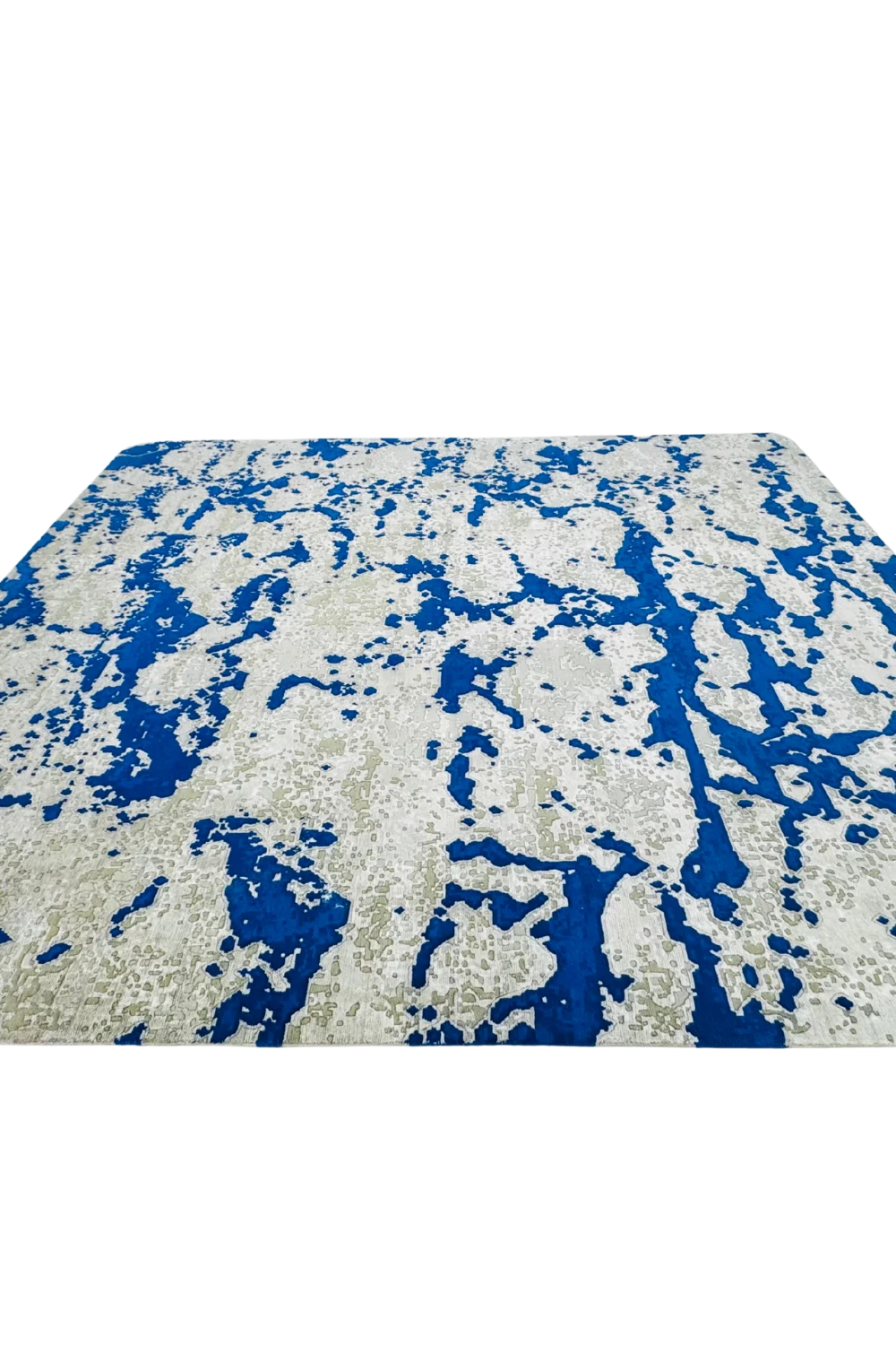 Luxury abstract rug in cobalt blue and beige for statement interiors.