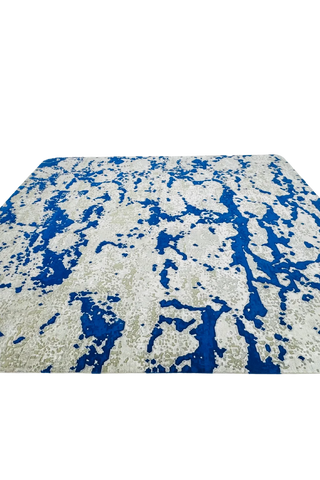 Luxury abstract rug in cobalt blue and beige for statement interiors.