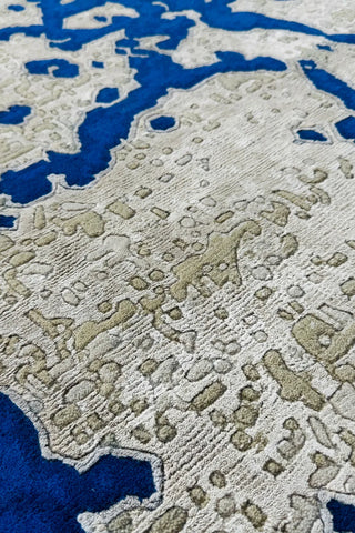 Premium abstract wool rug with bold blue and beige contrast.
