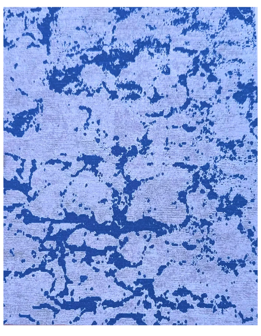 Hand-knotted blue and beige abstract wool rug with pixel pattern.
