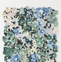 Floral pattern with blue, green, white, yellow and bloack color in a rug