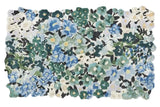 Luxury handwoven floral rug with blue, green, and white wildflower pattern from Mannat Rugs