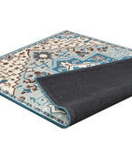 Blue and ivory traditional geometric floral rug with decorative border and black backing