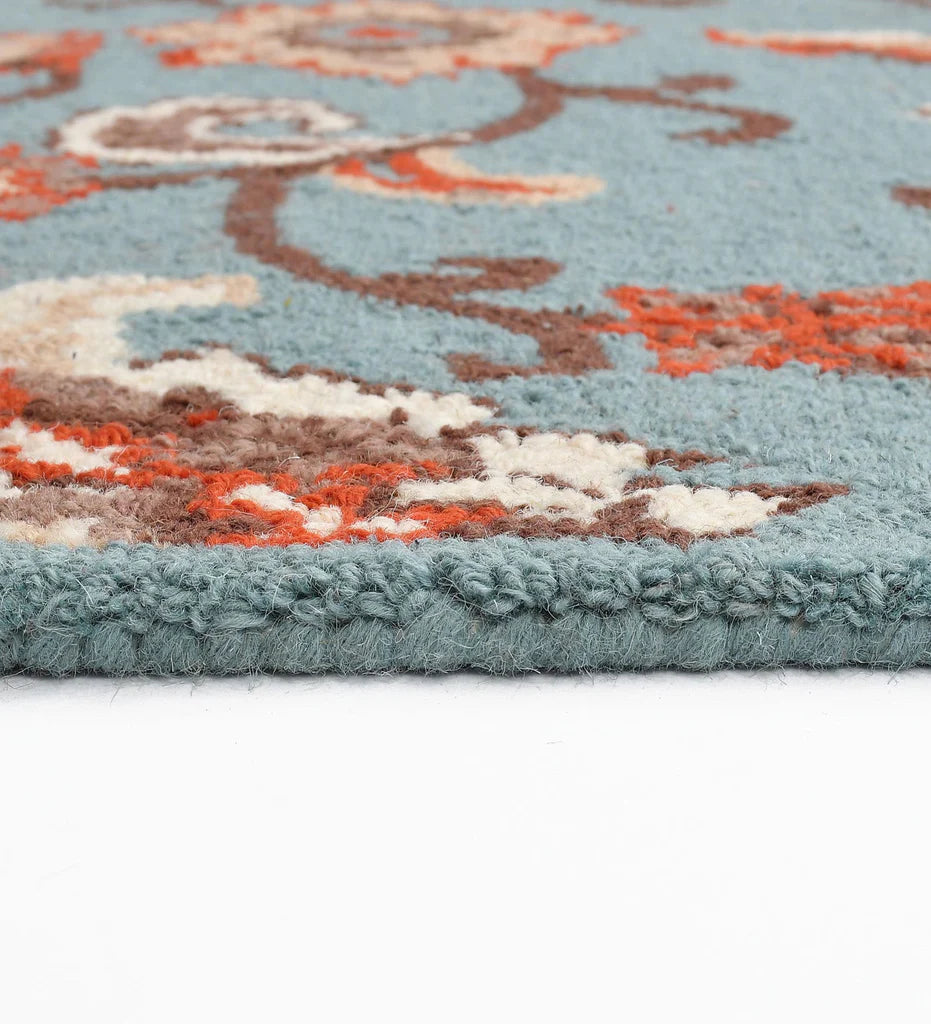 Persian-style floral wool rug in blue, red, and cream colors