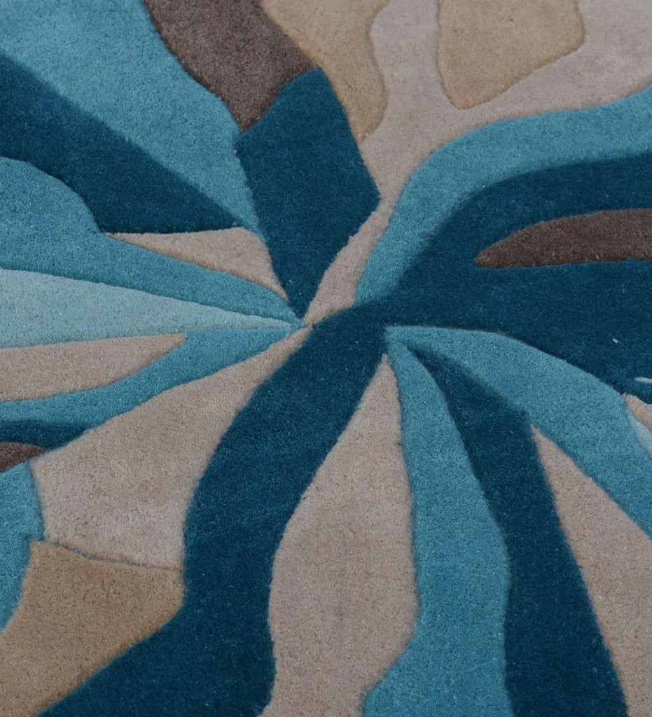 Handcrafted abstract wool carpet with blue and brown tones.