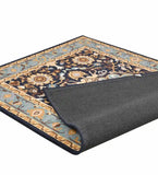 Blue and beige traditional floral area rug with decorative border and folded corner