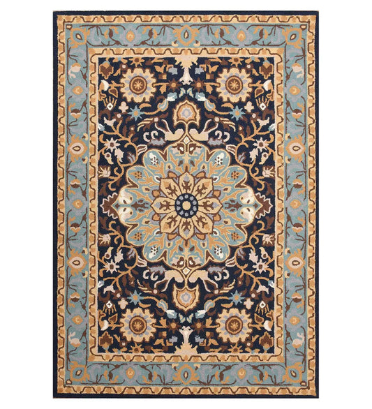 Hand-tufted blue and beige wool rug with traditional floral patterns in a classic style.