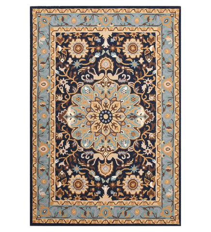 Hand-tufted blue and beige wool rug with traditional floral patterns in a classic style.