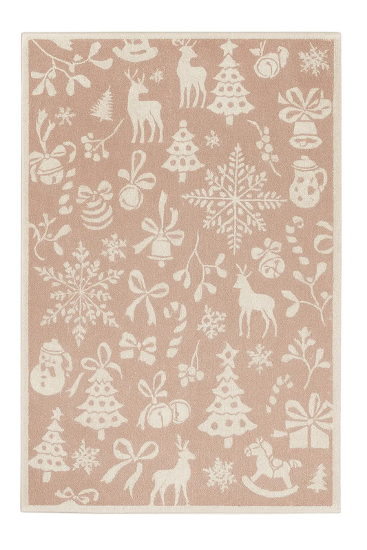 Blush pink Christmas rug with cream reindeer, snowflakes, and festive silhouettes