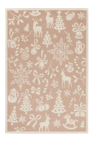 Blush pink Christmas rug with cream reindeer, snowflakes, and festive silhouettes