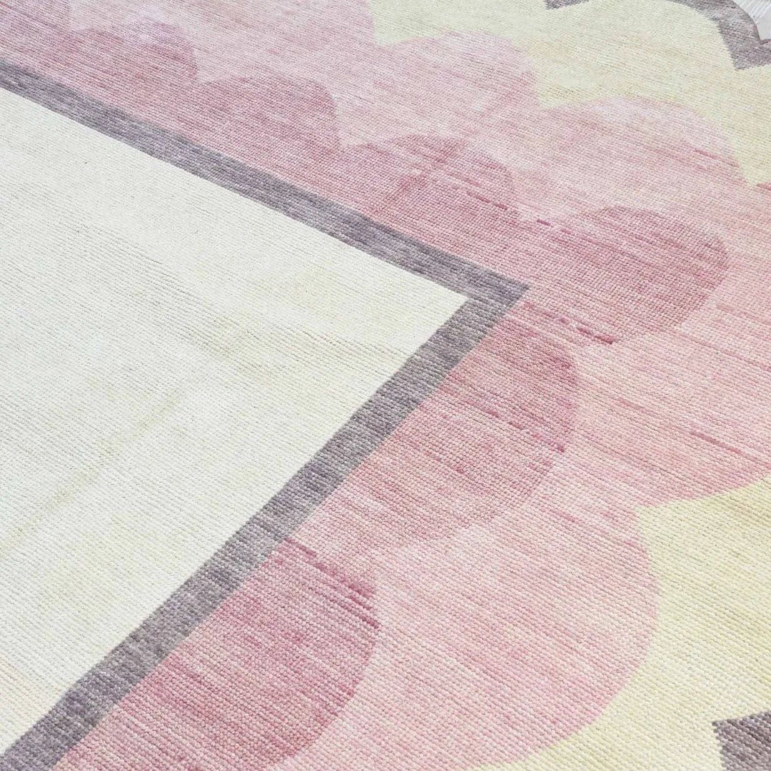 Blush pink with all shades of pink hand knotted wool rug.
