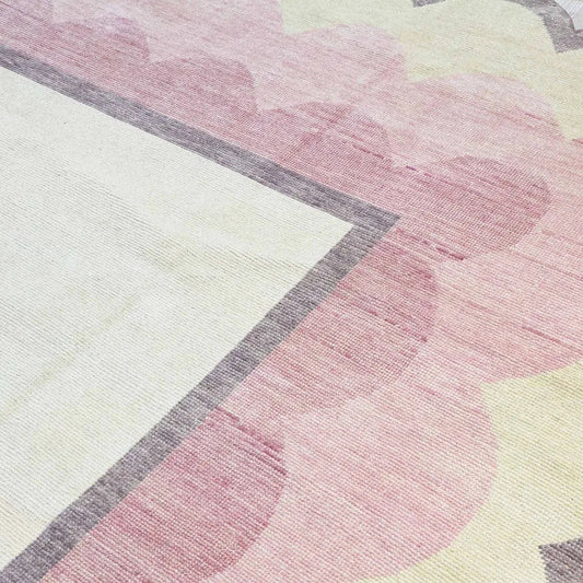Blush pink with all shades of pink hand knotted wool rug.