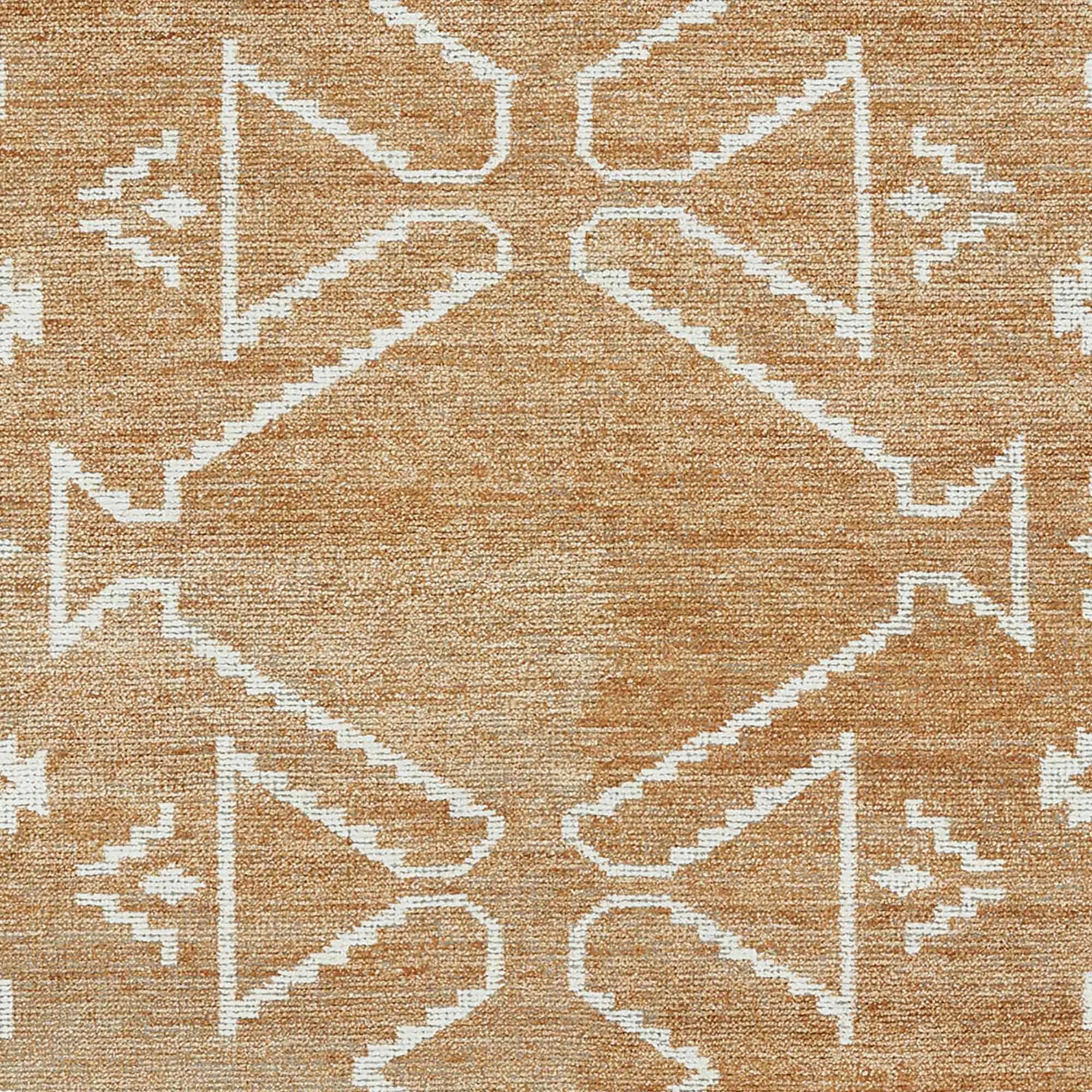 Tribal design wool rug in beige and white for boho interiors.