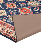 Boho traditional handwoven rug with vibrant geometric patterns in blue, orange, and cream colors, corner folded