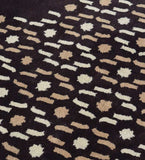 Luxury wool rug in brown with cream and tan dotted detailing