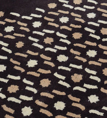 Luxury wool rug in brown with cream and tan dotted detailing