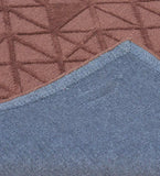 Minimalist embossed wool rug in earthy brown tones