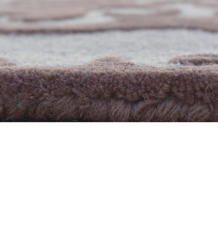 Elegant embossed rug with damask pattern in brown tones