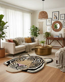 Brown tiger face–shaped irregular area rug with a hand-tufted texture, featuring detailed animal artwork that adds a bold, statement-making accent to the interior space