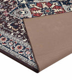 Burgundy vintage style rug with intricate floral and geometric patterns, partially folded showing beige backing