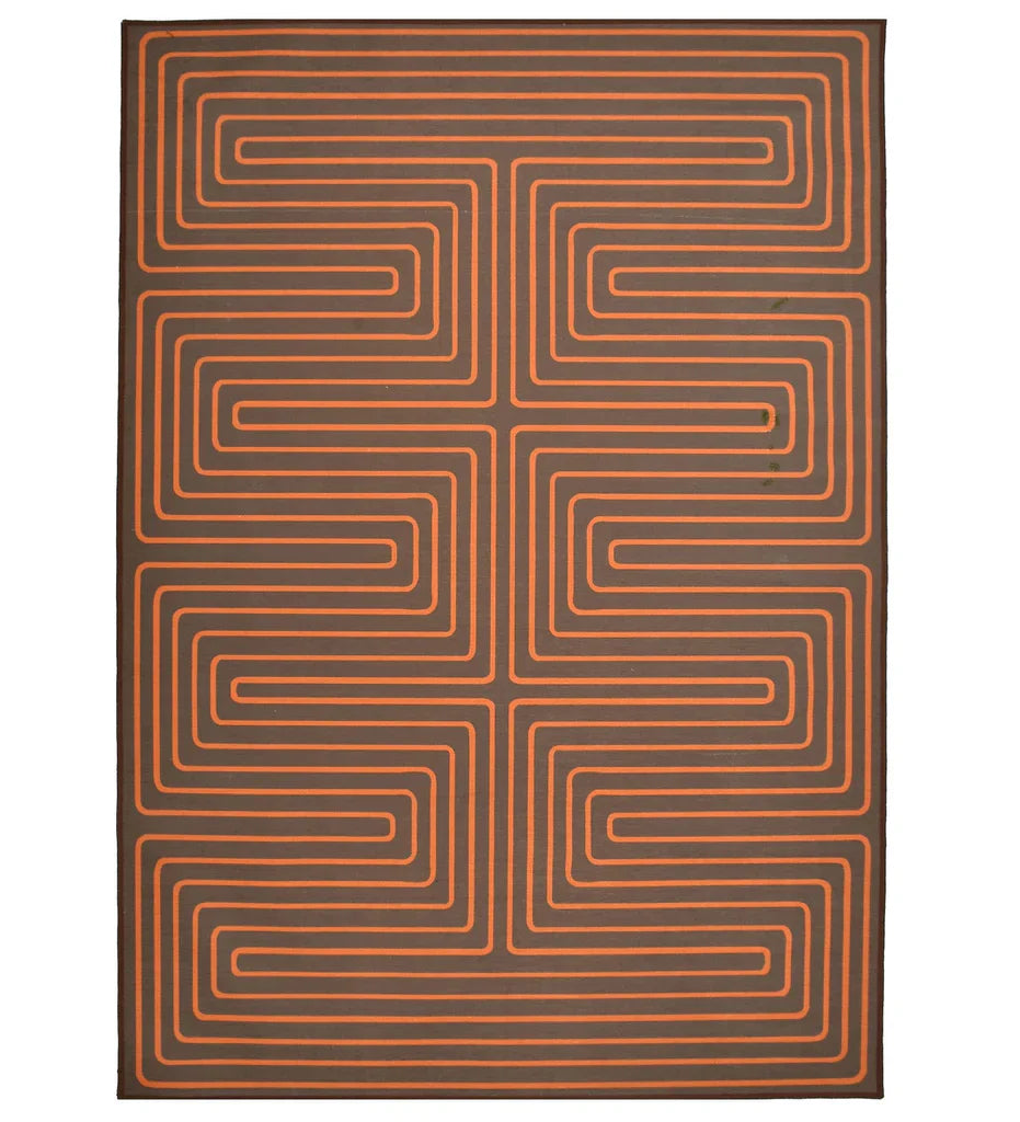 Burnt orange maze patterned rug for modern interiors.