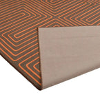 Burnt orange and brown maze pattern luxury rug with folded corner, handwoven decorative floor decor