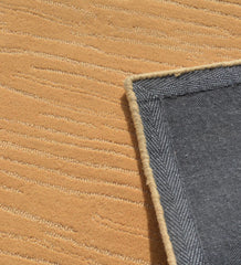 Contemporary camel wool rug with subtle line embossing