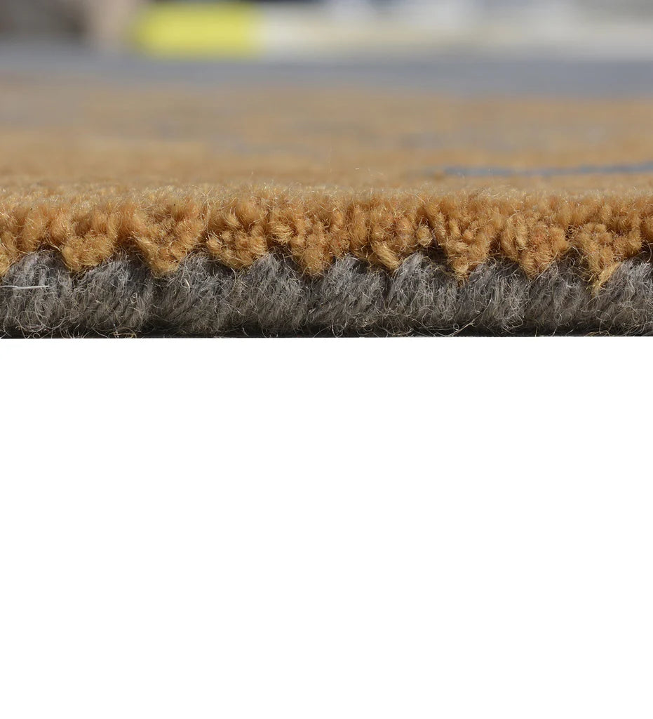 Art-inspired wool rug with golden brown abstract streaks on grey base