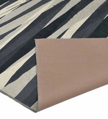 Modern charcoal abstract rug for minimalist interiors.