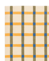 Soft wool tartan rug featuring modern plaid grid pattern