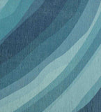 Luxury coastal blue abstract ocean rug with layered wave patterns in various blue shades