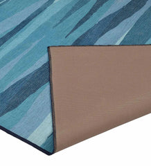 Abstract washable rug with beach-inspired color palette.