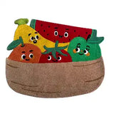 Colorful handwoven fruit basket rug featuring playful banana, orange, tomato, watermelon, and green pepper faces
