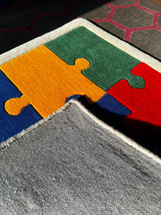 Colorful puzzle piece rug backing