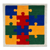 Colorful handwoven puzzle piece rug with blue, red, green, and yellow sections and white border