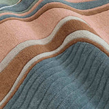 Luxury handwoven abstract rug with textured wavy lines in blue, brown, pink, and gray tones