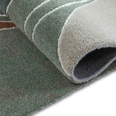 Luxury Hand-Tufted Wool Rug with Contemporary Artistic Pattern.