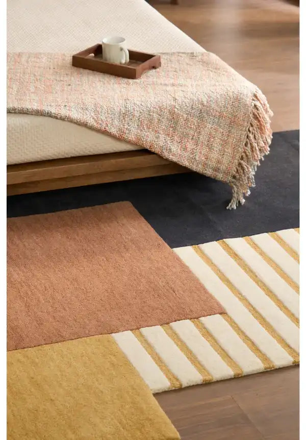 Premium wool rug featuring modern abstract color sections.
