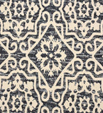 Cream geometric floral patterned luxury rug with black textured background from Mannat Rugs