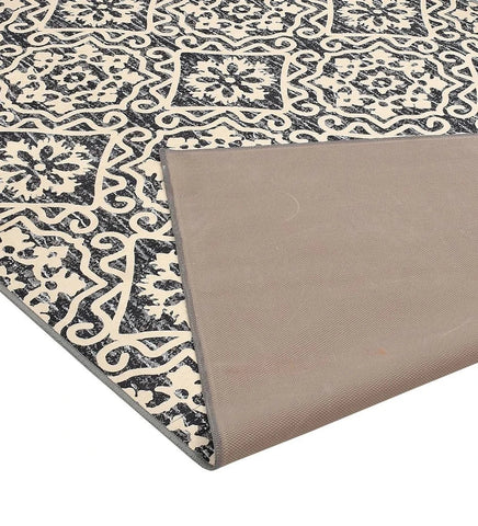 Durable cream and gray floral geometric area rug.