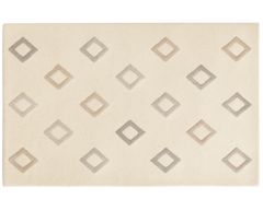 Modern cream geometric diamond rug for living room interiors.
