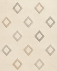Hand-tufted wool rug in soft cream with subtle diamond texture.