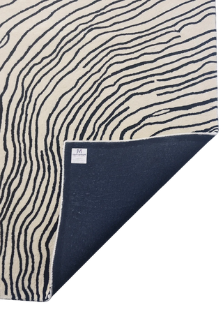Luxury cream and black modern rug for living room decor.