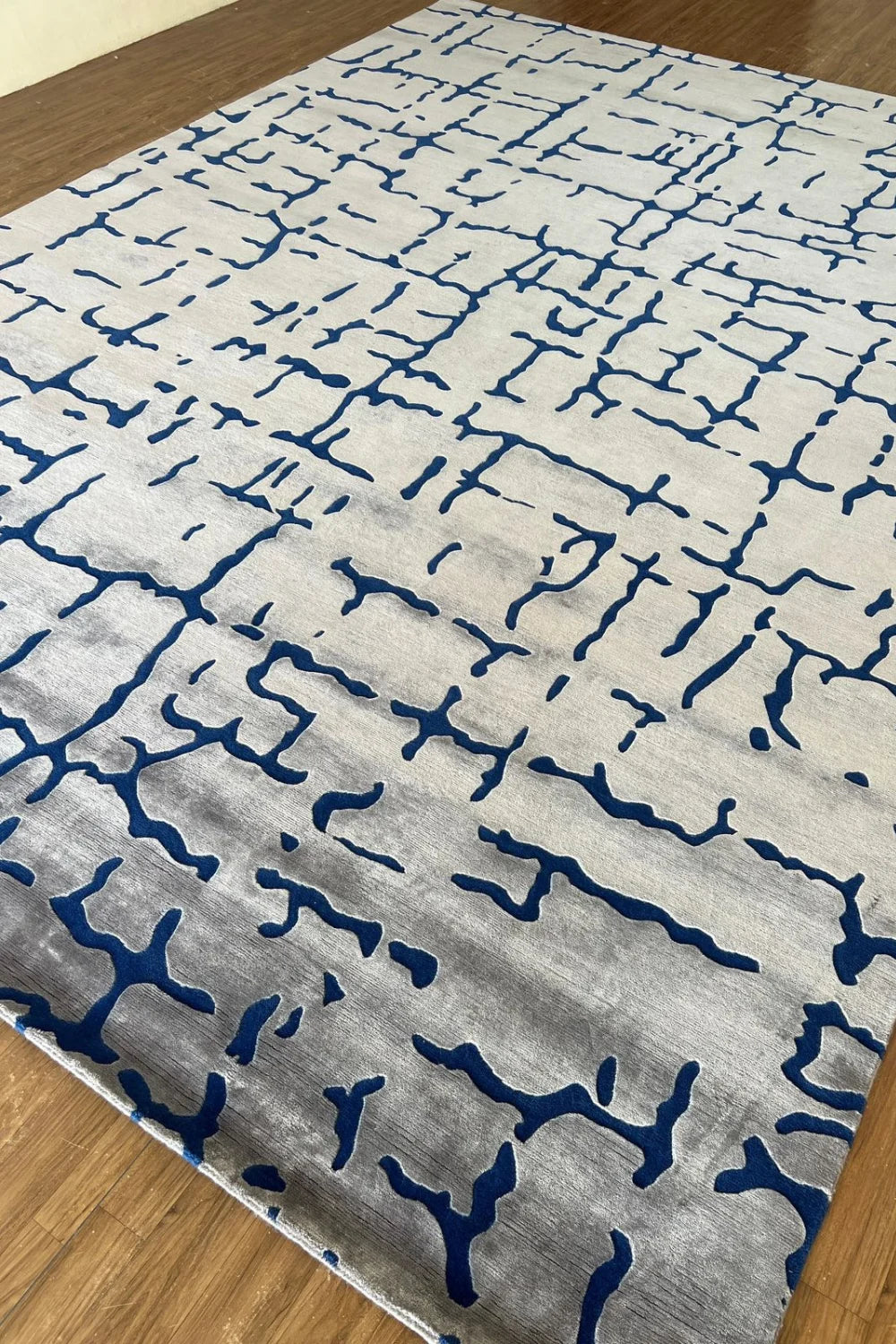 Contemporary abstract cream and blue handwoven rug.