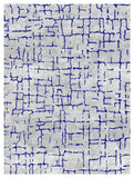 Cream wool rug with blue abstract crackle pattern and textured surface