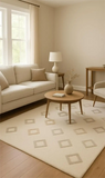 Minimalist cream diamond rug – luxury wool handcrafted design.
