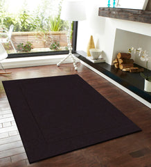 Solid dark brown wool rug for rustic and modern interiors