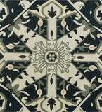 Close-up of dark green Heriz rug with intricate handwoven geometric floral pattern and beige accents